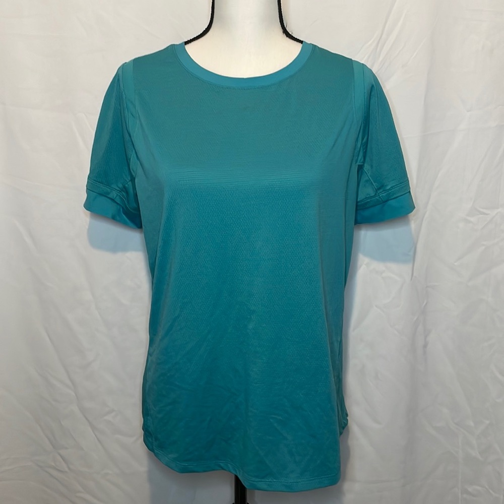 AVIA Size LG 12/14 woman’s teal athletic shirt.